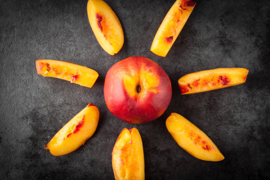 Yellow Nectarine Peach - Whole And Sliced On Dark Grunge Background. Top View