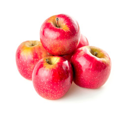 Stack of crisp red shiny apples isolated on white