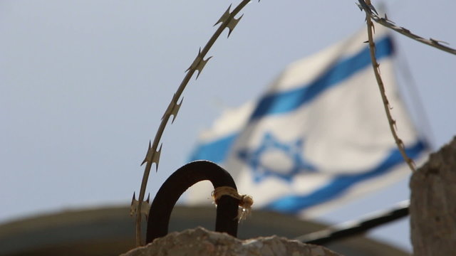 Flag of Israel on the border of Gaza