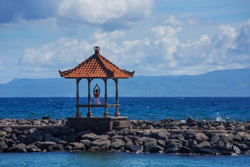 Caucasian woman practicing yoga at seashore
