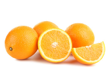 large and delicious sliced oranges laid out on a white isolated background