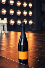 Dark stylish romantic decoration with champagne, branches