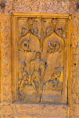 Detail of old wooden door carved