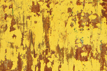 Yellow rust on a metal wall, the old background