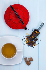 Traditional Japanese teapot, tea, leaves and sugar