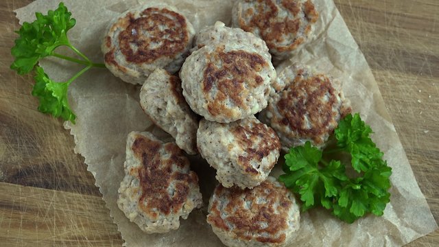 Rotating Mini Burgers (fresh made, seamless loopable 4K UHD footage)
