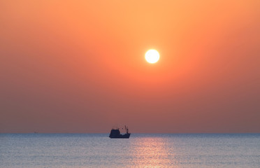 Boat on the sea at sunset