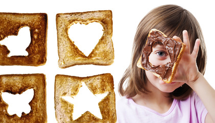 little girl looking through  bread with chocolate  butter