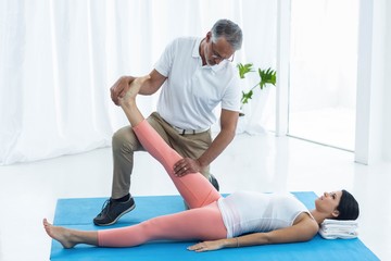 Doctor giving physiotherapy to pregnant woman