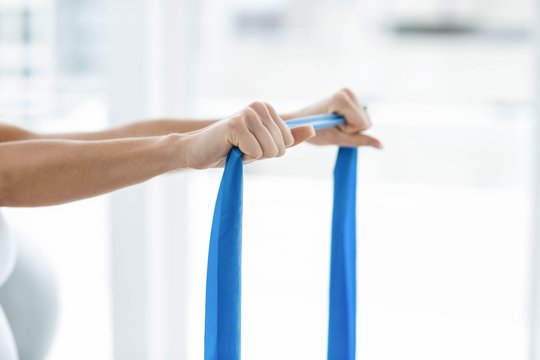 Pregnant woman performing stretching exercise