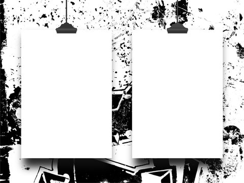 Close-up of two hanged paper sheets with clips on black and white ink splotchy background