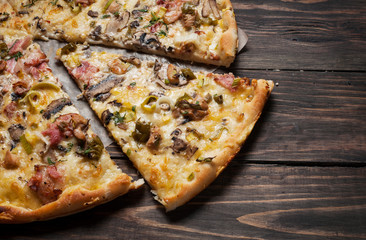 Delicious italian pizza served on wooden table. Closeup