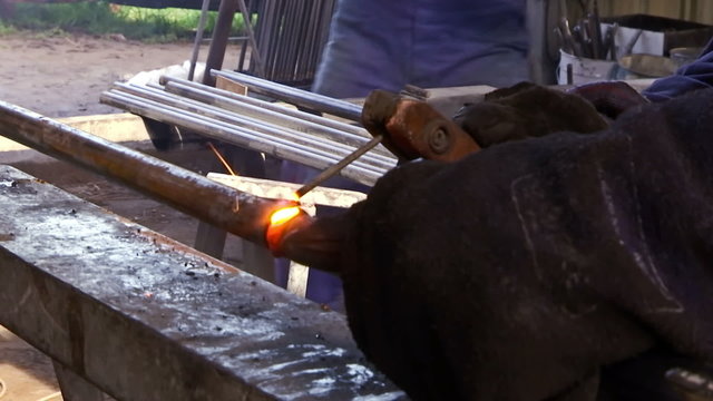 Gas welding of metal elements