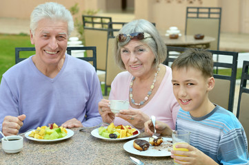 Grandparents with grandchild at breakfast