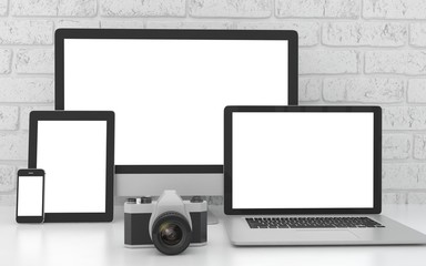 Responsive mockup screen. Monitor, laptop, tablet, phone on table in office.