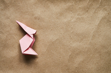 Pink bunny on eco craft paper background