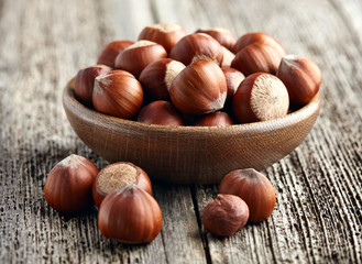 Hazelnuts on a wooden background