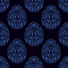 Seamless pattern from eggs with blue floral ornament