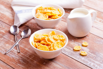 Cornflakes and milk for breakfast closeup