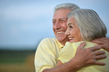 happy senior couple in summer