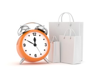 alarm clock and shopping bag (time to buy concept)
