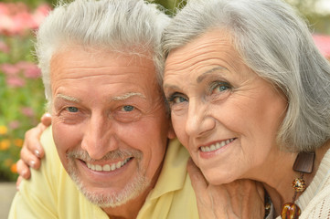 mature couple on  in summer park