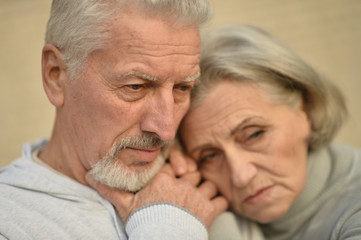 Mature couple near wall