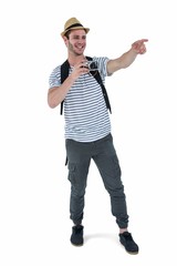 Handsome man pointing with retro camera