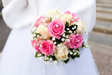 Beautiful wedding bouquet of flowers in bride’s hands