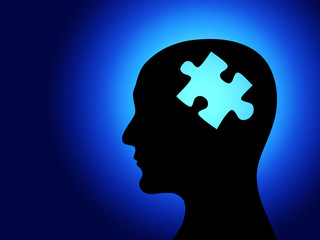 Human profile and brain in the form of the puzzle