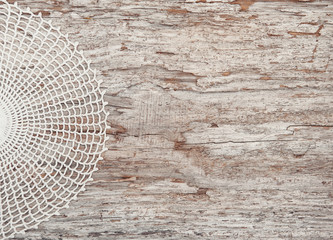 Lace fabric on the old wood