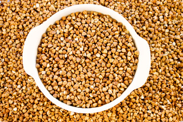 Buckwheat groats in a white mini pot