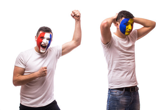 France vs Romania on white background. Football fans of Romania  and France national teams demonstrate emotions: Romanian lose, France win.  European  football fans concept.
