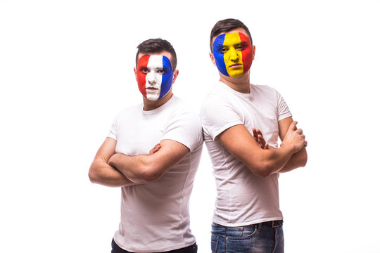 France vs Romania on white background. Football fans of Romania  and France national teams look at camera. European football fans concept.