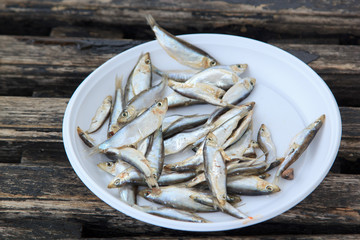 fish on white plastic plate