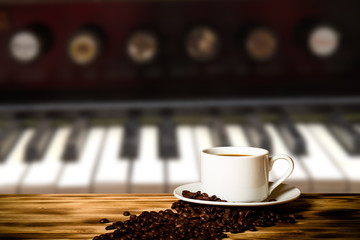 Coffee in a cup on wooden table opposite a defocused the interio