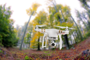 White drone quad copter with 4K digital camera flying. - obrazy, fototapety, plakaty