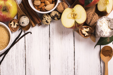 Apple pie ingrediens over white wooden background. Baking concept background