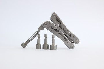 multitool with many functions and a white background