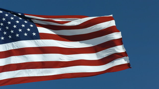 United States flag waving in wind, slow motion
