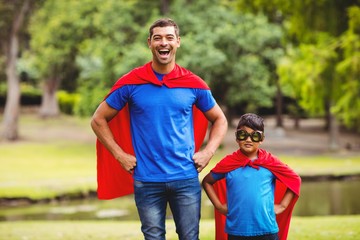 Father and son in superhero costume