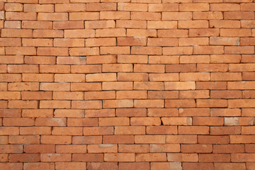 Design on orange brick wall for pattern and background