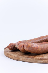 Raw sausages on the cutting board