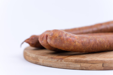 Raw sausages on the cutting board