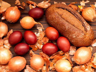 Red colored Easter eggs and homemade bread