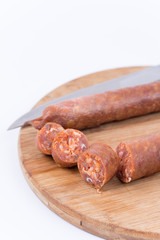 Sliced raw sausage on the cutting board