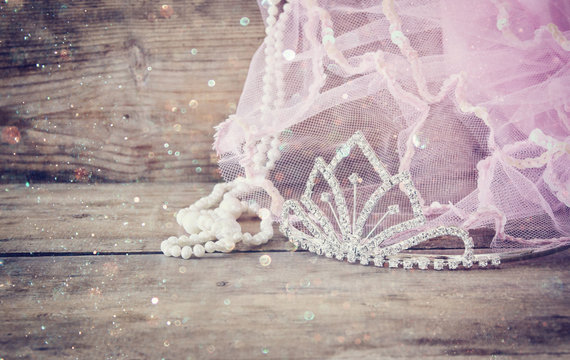 Wedding vintage crown of bride, pearls and pink veil. wedding concept. vintage filtered and toned image with glitter overlay. selective focus