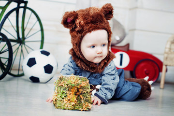 baby boy dressed as a bear