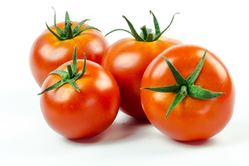 Tomatoes. Whole and a half isolated on white
