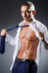 Ripped young man in studio concept